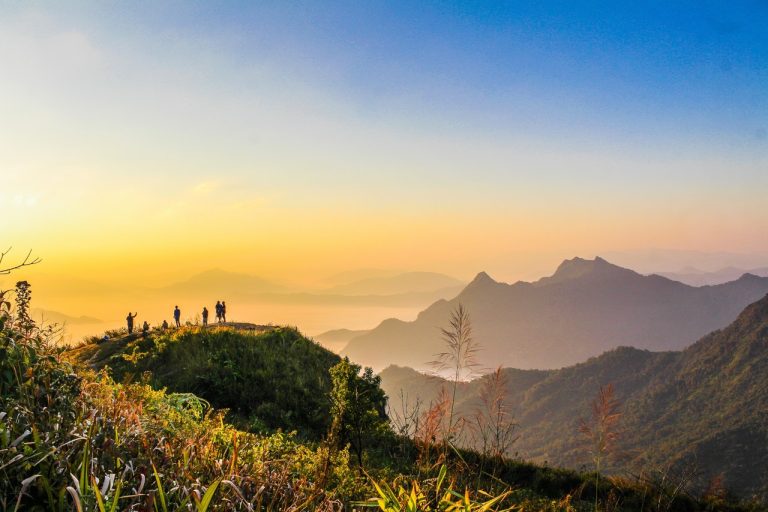 Home Photo Of People Standing On Top Of Mountain Near Grasses 733162 768x512